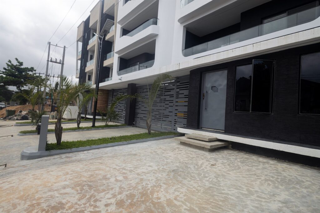 Brum Height 8: Paved entrance forecourt with planting beside the building